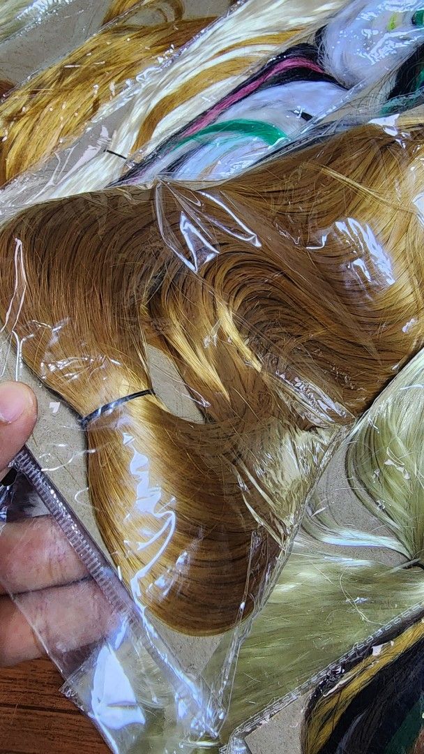 Assorted Synthetic Hair Extensions - Various Colors (Category: Hair Accessories) located in Baguio. Submitted by chiechie1234 (Listing ID 1441245263, Image 3). Description: - 31 PCS ( TAKE ALL ) - Bundle of synthetic hair extensions - Variety of colors: solid blonde, brown, and multi-colored streaks (purple, green, blue, yellow) - Different styles included - Ideal for adding volume or trying new hairstyles - All items are brand new and in origina