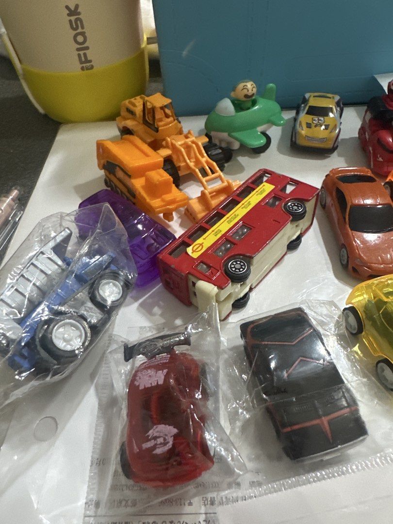 Assorted Toy Cars and Vehicles (Category: Vehicle & Diecast Models) located in Cainta. Submitted by shopbyyna (Listing ID 1441217963, Image 3). Description: - Collection of toy cars and vehicles - Includes: yellow race car (No. 8), green bus, red bus, construction vehicle, and various smaller cars - Some items are still in original packaging - Ideal for toy car collectors or children - All items are sold as pictured.