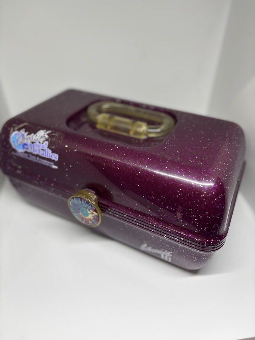 Authentic 90’s Retro Purple Caboodles (Category: Makeup) located in Manila. Submitted by hotstuffmanila (Listing ID 1441364714, Image 1). Description: Authentic 90’s Vintage Retro Purple Make-up Caboodles This purple glitter Caboodles makeup organizer is a vintage Liquid Metallics model Selling between $35-45 USD in ebay for collectors. .
