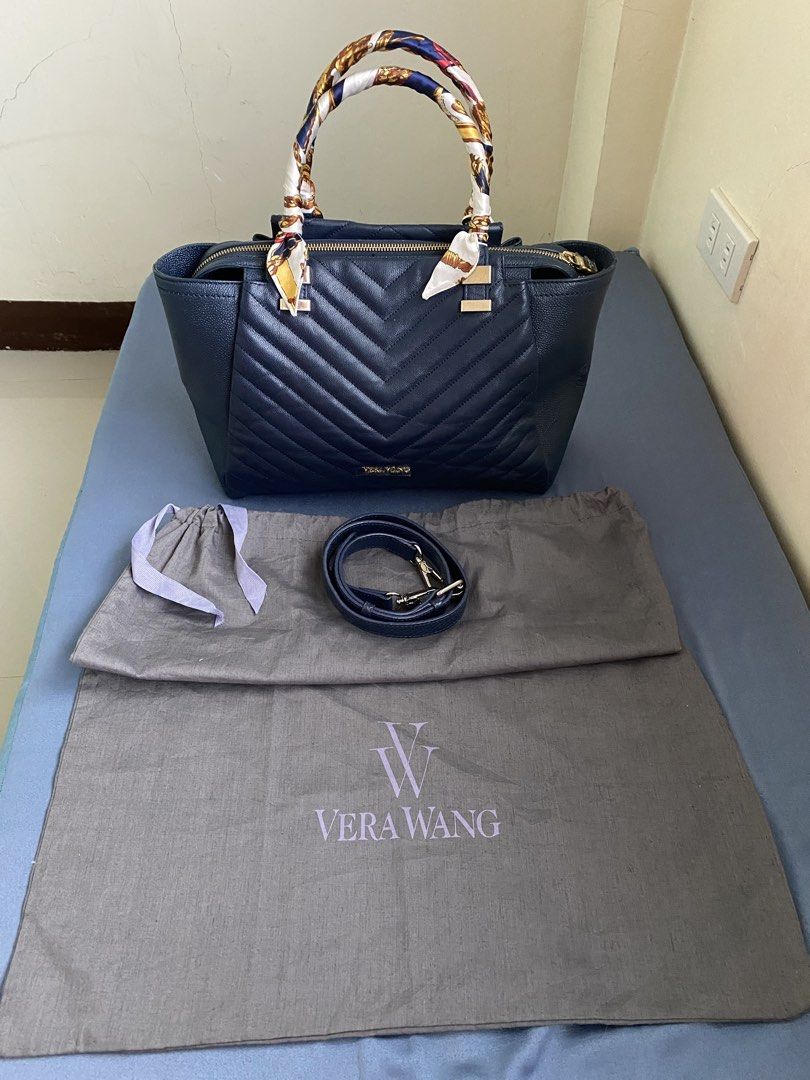 Authentic Vera Wang Bag (Category: Luxury Bags & Wallets) located in Cebu City. Submitted by quing1993 (Listing ID 1441218028, Image 2). Description: Authentic Vera Wang Navy Blue Chevron-Quilted exterior Medium 2-way bag No rubs Ni crackings Gold tone hardware You are buying pre-loved piece so expect signs of wear. Please inspect pictures and ask questions to avoid buyer's remorse. No return and no exchange. NO RETURN, NO EXCHANGE. Thank you!.