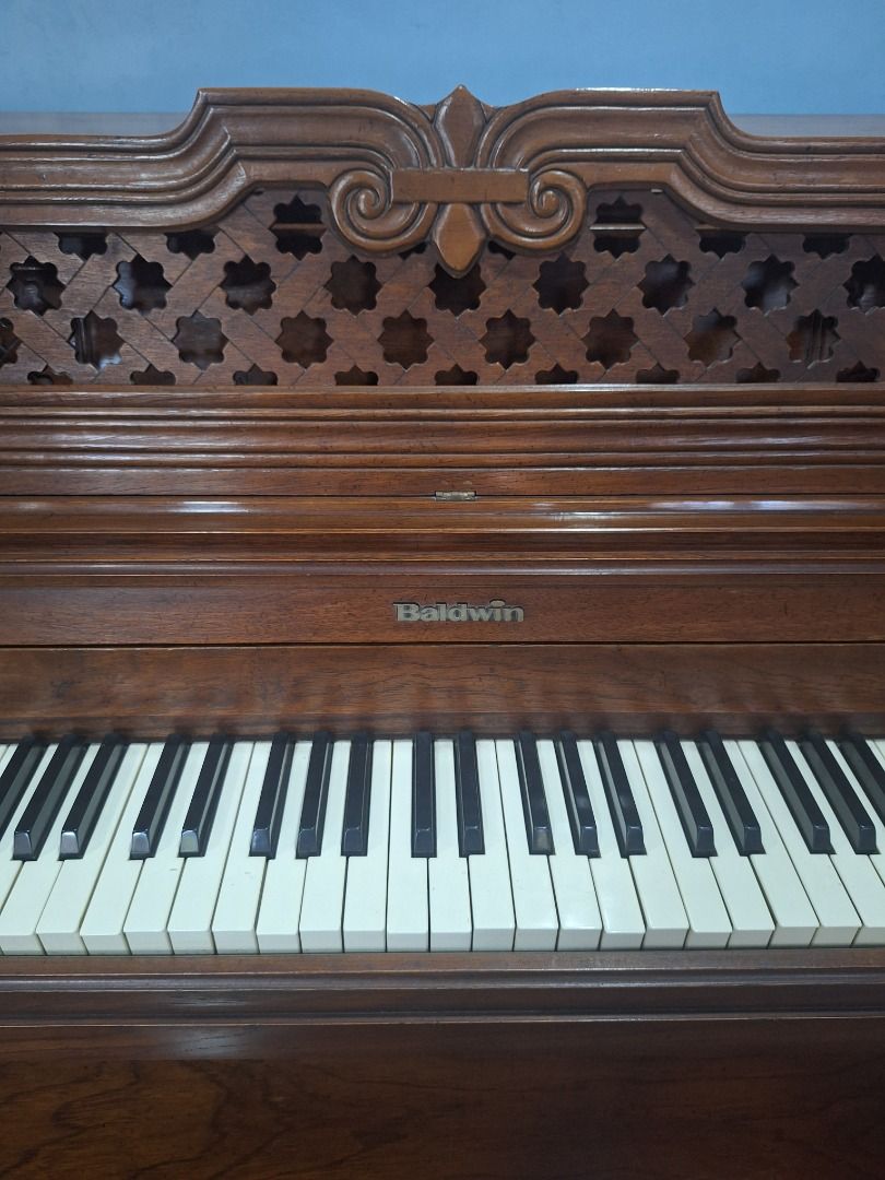 Baldwin Console Upright Piano w/ Bench – Needs Repair/Tuning (Category: Musical Instruments) located in Las Pinas. Submitted by homedispatch (Listing ID 1441211971, Image 2). Description: Baldwin Console Upright Piano w/ Bench – Made in USA – Needs Repair/Tuning We are selling our Baldwin console upright piano, US-made instrument suitable for beginners and families willing to have it serviced. Details: - Brand: Baldwin (Made in USA) - Type: Conso