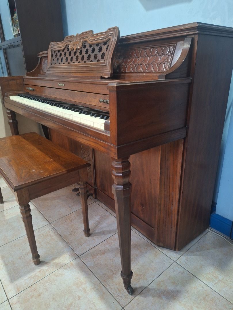 Baldwin Console Upright Piano w/ Bench – Needs Repair/Tuning (Category: Musical Instruments) located in Las Pinas. Submitted by homedispatch (Listing ID 1441211971, Image 3). Description: Baldwin Console Upright Piano w/ Bench – Made in USA – Needs Repair/Tuning We are selling our Baldwin console upright piano, US-made instrument suitable for beginners and families willing to have it serviced. Details: - Brand: Baldwin (Made in USA) - Type: Conso