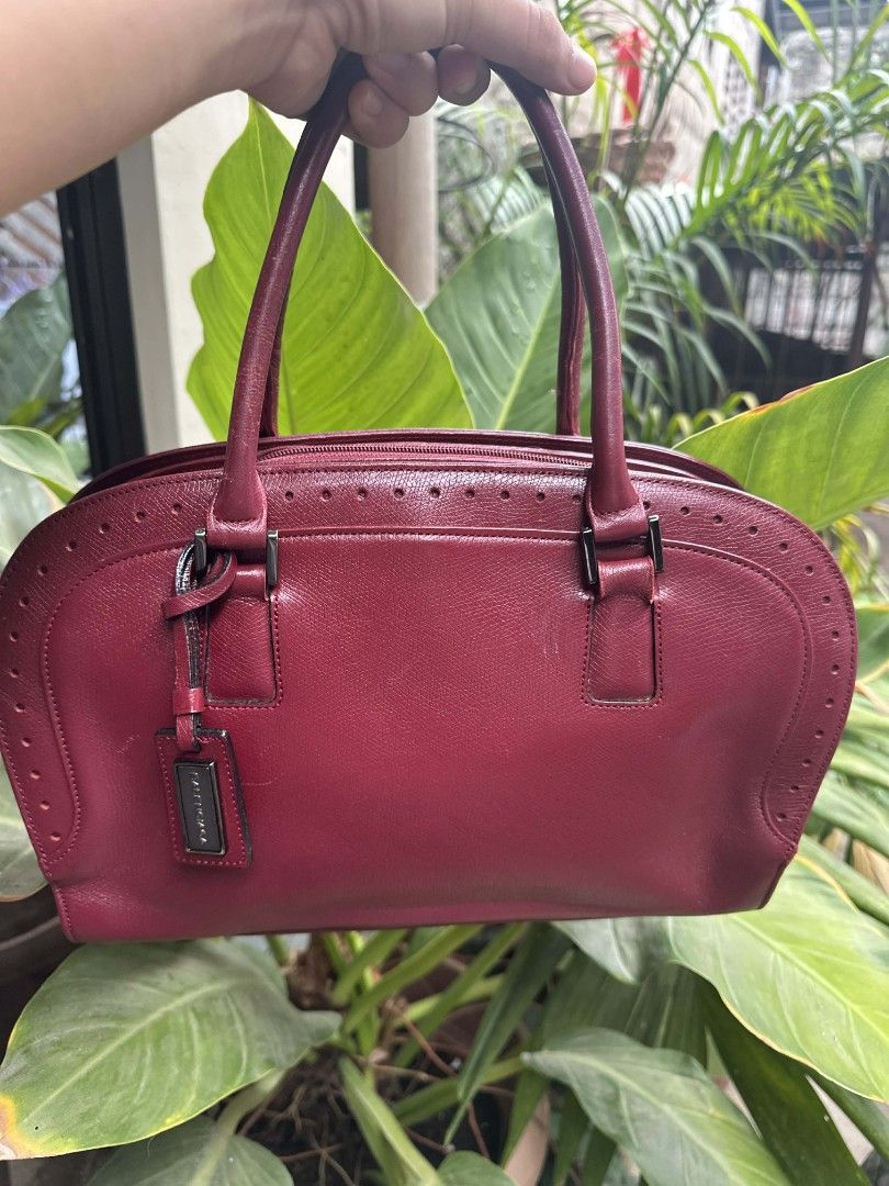 Balenciaga Red Leather Handbag (Category: Luxury Bags & Wallets) located in Dumaguete. Submitted by aryanukay (Listing ID 1441172079, Image 1). Description: - Authentic Balenciaga red leather handbag - Classic design with top handles - Features an interior zippered pocket - Perfect for everyday use - Made in Italy.