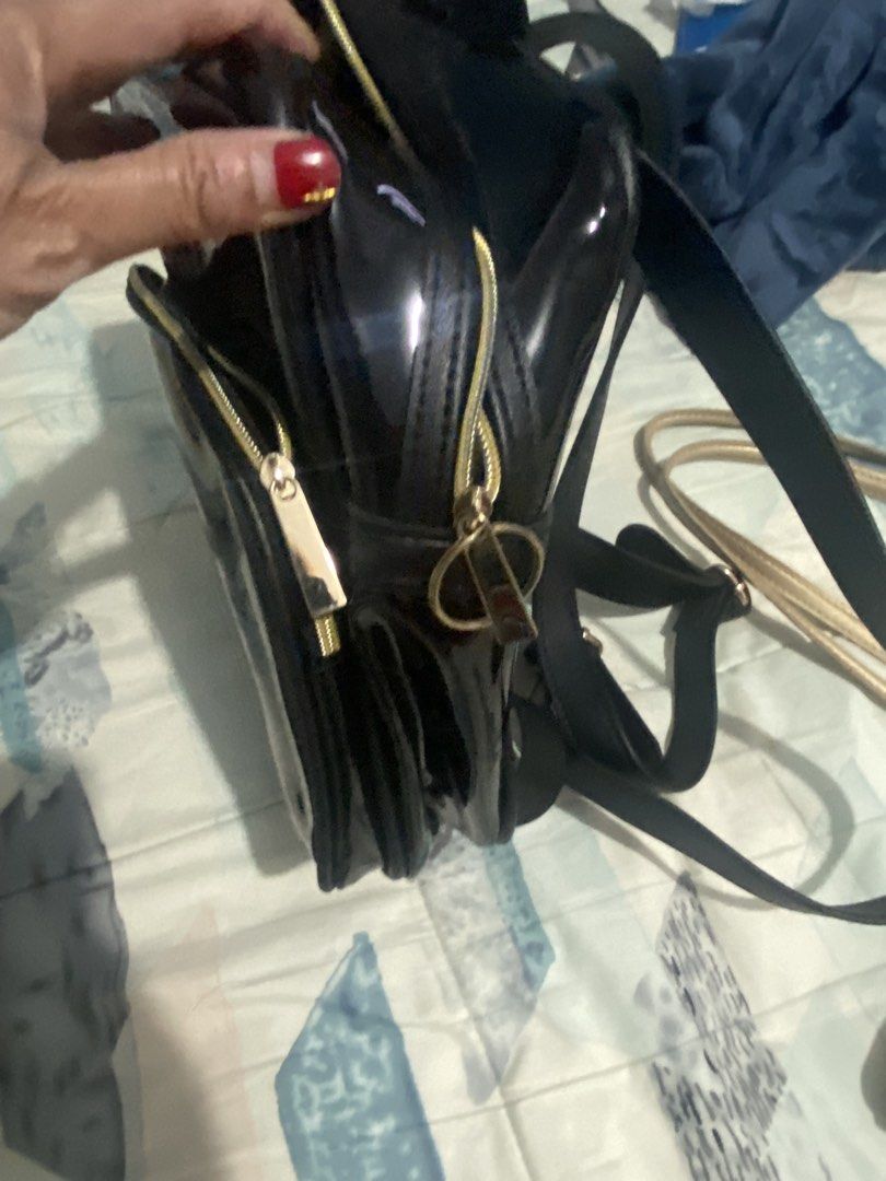 Black Patent Leather Backpack with Gold Zippers (Category: Backpacks) located in Bocaue. Submitted by 10evangelinehernande278 (Listing ID 1441206977, Image 3). Description: - Shiny black patent leather backpack - Front zipper pocket - Spacious main compartment - Gold zippers for a stylish contrast - Adjustable straps for comfortable wear - Versatile for everyday use or evening outings Nabili lng po sa store s okada manila🥰.