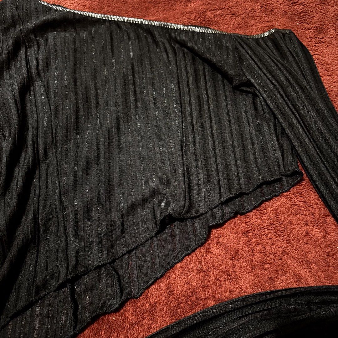 Black Sheer Sparkly One Shoulder Long Sleeve Top (Category: Longsleeves) located in San Juan City. Submitted by helpabaddietodecclutter (Listing ID 1441326404, Image 2). Description: - Chic black one-shoulder top - Sheer material with vertical ribbing - Subtle sparkle threads for added flair - Unique asymmetrical hemline - Long sleeves - Versatile: great for layering or as a standalone piece.