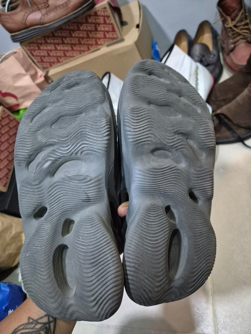 Black Yeezy Foam Runner Sandals (Category: Slippers & Slides) located in Manila. Submitted by markpim (Listing ID 1441315046, Image 2). Description: - Black Yeezy Foam Runners - Unique clog design with breathable cutouts - Comfortable and lightweight - Easy slip-on and off - Ideal for casual summer wear -Rfs declutter - Needs cleaning.