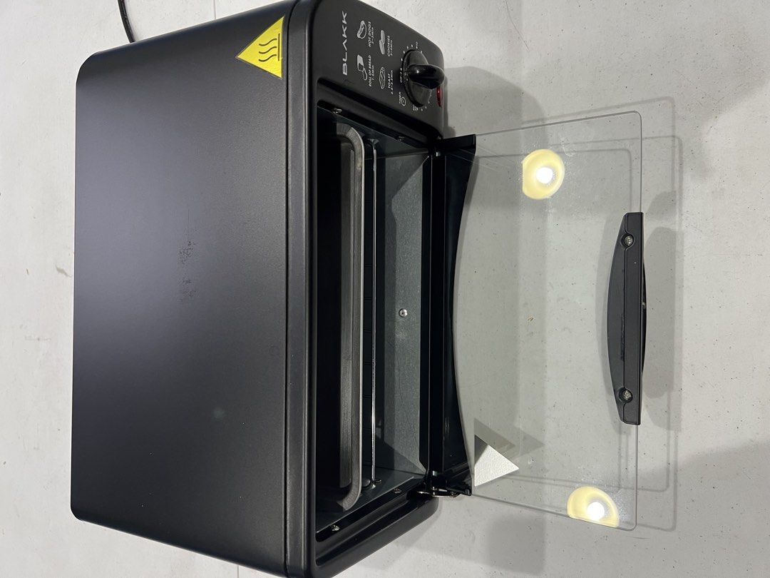 BLAKK Oven Toaster 9 Liter Capacity (Category: Ovens & Toasters) located in Manila. Submitted by migsvillanueva (Listing ID 1441314740, Image 3). Description: - Compact BLAKK oven toaster - 9 Liter capacity - 30-minute timer with bell ringer - 2 quartz heating elements - Indicator light - Ideal for toasting bread, hot dogs, and cookies - Easy to use controls - Please check photos for more details.