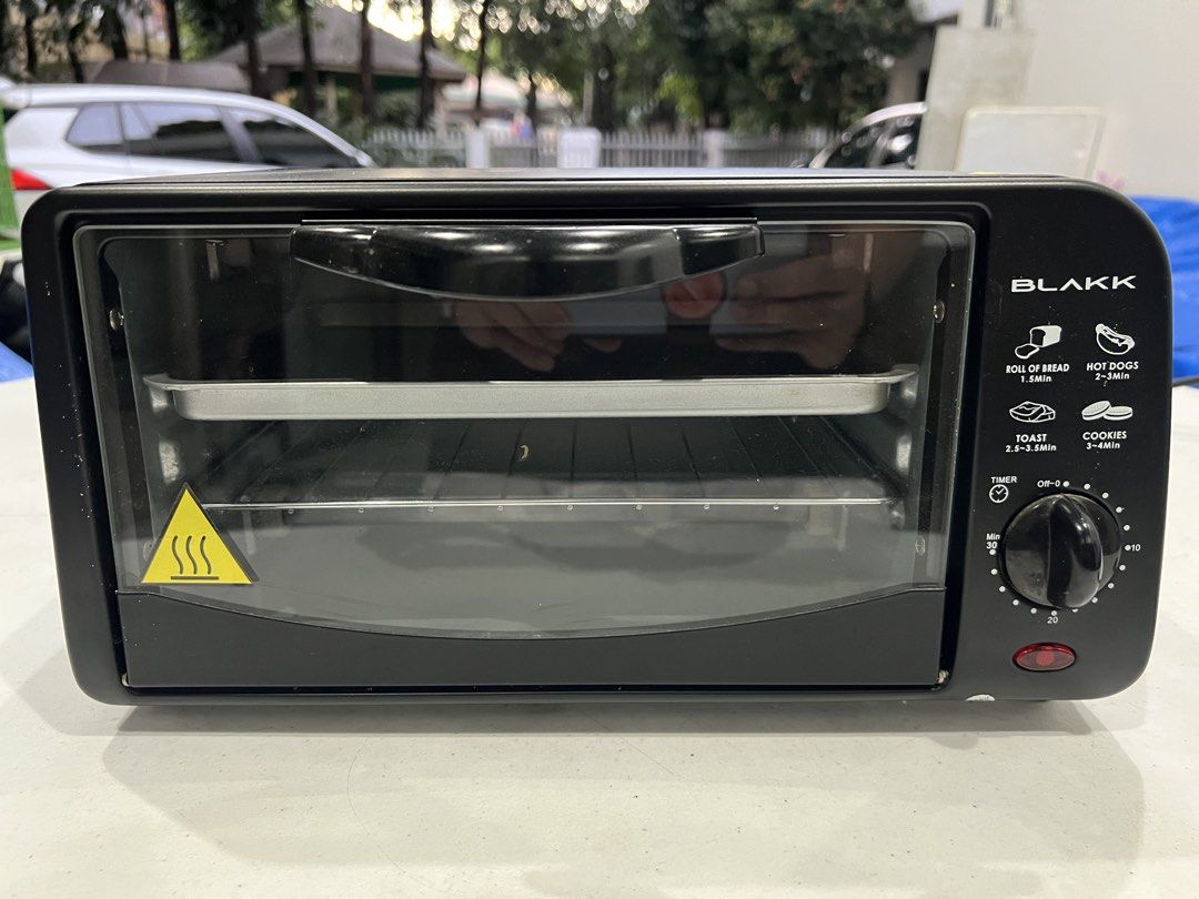 BLAKK Oven Toaster 9 Liter Capacity (Category: Ovens & Toasters) located in Manila. Submitted by migsvillanueva (Listing ID 1441314740, Image 2). Description: - Compact BLAKK oven toaster - 9 Liter capacity - 30-minute timer with bell ringer - 2 quartz heating elements - Indicator light - Ideal for toasting bread, hot dogs, and cookies - Easy to use controls - Please check photos for more details.