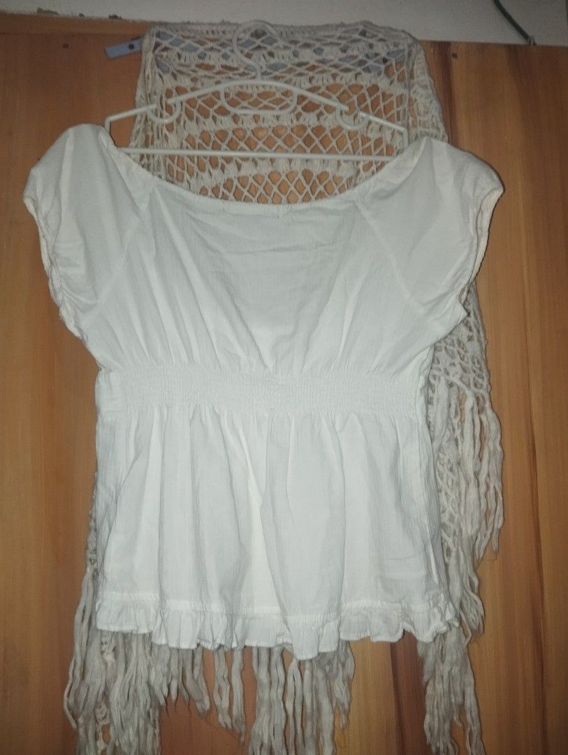 Brandy Melville Milkmaid Top (Category: Sleeveless) located in Baguio. Submitted by pooh111 (Listing ID 1441287418, Image 3). Description: White peplum top with short sleeves. Has a button-up front and elasticated waist. Ruffled hemline. first photo from pinterest (for ww).