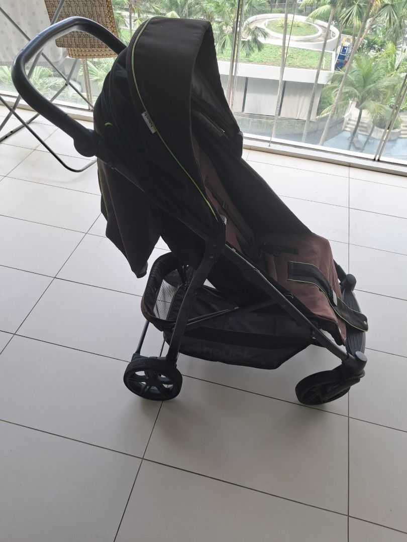 Brown Baby Stroller (Category: Strollers) located in Singapore. Submitted by divaqueen1 (Listing ID 1441241176, Image 2). Description: - Brown stroller with lime green trim - Includes canopy for sun protection - Convenient storage basket underneath - Sturdy wheels for smooth rides - Folds compactly for easy storage - Ideal for convenient travel with your child.