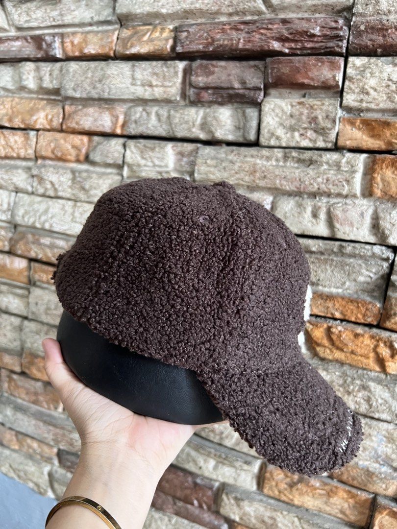 Brown Teddy Fleece Baseball Cap with 'S' Logo (Category: Caps & Hats) located in Manila. Submitted by markhie22 (Listing ID 1441225106, Image 2). Description: - Super cozy brown teddy fleece cap - Features a white 'S' logo on the front - 'THE UNIVERSAL SPORTS' embroidered on the brim - Adjustable strap at the back for a comfortable fit - Perfect for staying warm and stylish.