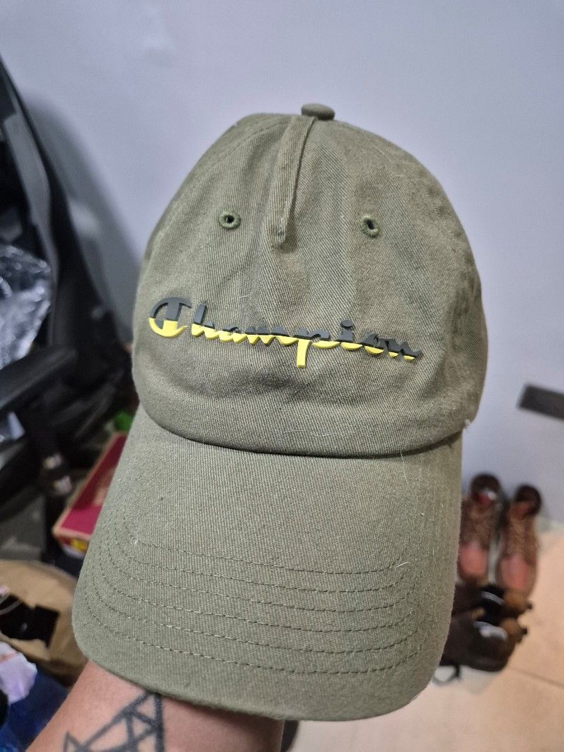 Champion Dad Cap Olive Green (Category: Caps & Hats) located in Manila. Submitted by markpim (Listing ID 1441325082, Image 1). Description: - Classic Champion baseball cap - Olive green color - Embroidered yellow Champion logo on front - Adjustable strap at the back for a custom fit - Ideal for everyday casual wear - Simple and timeless style.