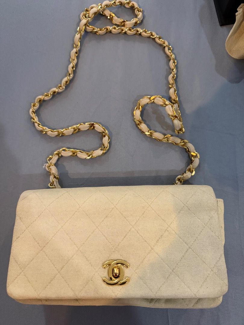 Chanel mini rectangular denim (Category: Luxury Bags & Wallets) located in Calamba. Submitted by drjc39 (Listing ID 1441223959, Image 1). Description: - Authentic Chanel shoulder bag in elegant cream color. - SERIES 1 with 24K plated gold hardware - Features classic diamond quilting for a timeless look. - Gold chain strap with luxurious fabric detail. - Interior boasts multiple compartments for organization. - "Made in France" stamp clearly visib