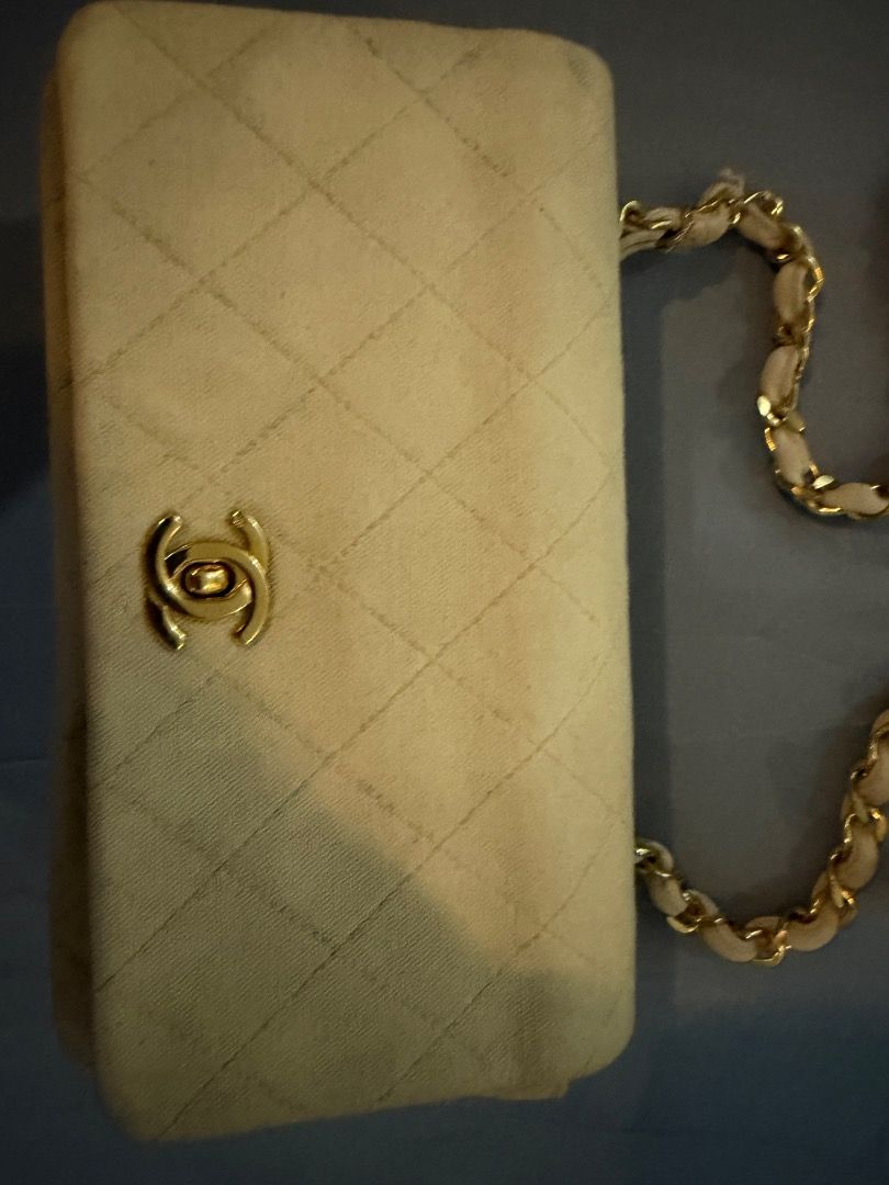 Chanel mini rectangular denim (Category: Luxury Bags & Wallets) located in Calamba. Submitted by drjc39 (Listing ID 1441223959, Image 2). Description: - Authentic Chanel shoulder bag in elegant cream color. - SERIES 1 with 24K plated gold hardware - Features classic diamond quilting for a timeless look. - Gold chain strap with luxurious fabric detail. - Interior boasts multiple compartments for organization. - "Made in France" stamp clearly visib