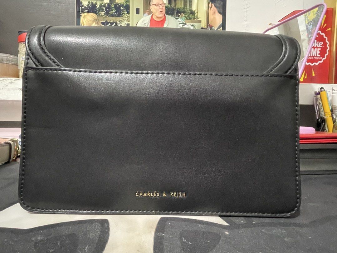 Charles & Keith Black Handbag with Gold Hardware (Category: Cross-body Bags) located in Makati City. Submitted by mooncherrielife (Listing ID 1441261464, Image 2). Description: Charles & Keith Bag in Black Condition: -Minor scuffs on gold hardware. Pwede gamitan ng polish -No strap ( can also buy online) Ideal for everyday use or evening occasions 🚨 PLEASE READ BEFORE MESSAGING 🚨 💰 THIS IS MY LOWEST PRICE – I won’t reply to messages asking for