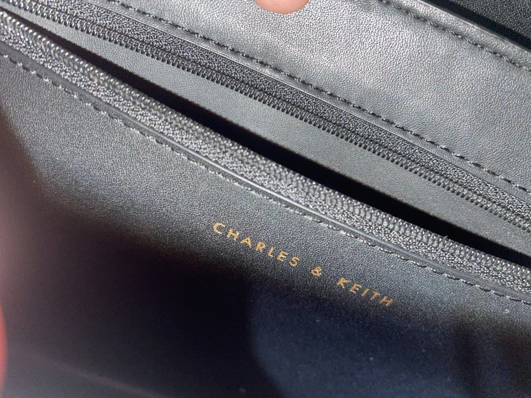 Charles & Keith Black Handbag with Gold Hardware (Category: Cross-body Bags) located in Makati City. Submitted by mooncherrielife (Listing ID 1441261464, Image 3). Description: Charles & Keith Bag in Black Condition: -Minor scuffs on gold hardware. Pwede gamitan ng polish -No strap ( can also buy online) Ideal for everyday use or evening occasions 🚨 PLEASE READ BEFORE MESSAGING 🚨 💰 THIS IS MY LOWEST PRICE – I won’t reply to messages asking for
