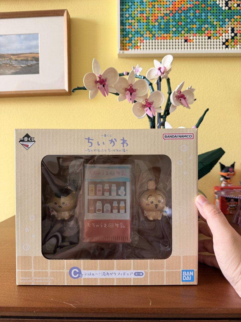 Chiikawa Ichiban Kuji Figure Set Bandai Namco (Category: Toy Figures) located in Singapore. Submitted by happyshoppie (Listing ID 1441327638, Image 1). Description: - Authentic Chiikawa Ichiban Kuji figure set - Includes 2 figures and a mini vending machine - Officially from Bandai Namco - Brand new and packaging is intact - A must-have for any Chiikawa enthusiast!.