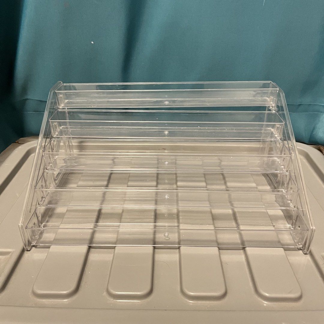 Clear Acrylic 6-Tier Display Stand Organizer (Category: Storage Boxes & Baskets) located in San Pablo. Submitted by thea_328 (Listing ID 1441370262, Image 2). Description: - 6-tier clear acrylic display stand - Ideal for organizing small items (nail polish, essential oils, craft supplies) - Keeps items tidy and visible - Easy to clean - Compact size fits most surfaces.