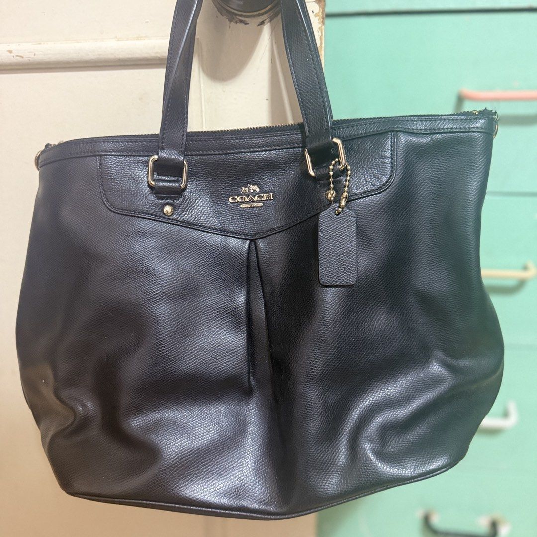 Coach Black Leather Tote Bag (Category: Luxury Bags & Wallets) located in Quezon City. Submitted by zoe_zee (Listing ID 1441306340, Image 3). Description: - Authentic Coach black leather tote bag - Secure zippered top closure - Multiple interior compartments for organization - Elegant gold hardware details - Shows some wear on strap attachment point - Perfect for everyday use.