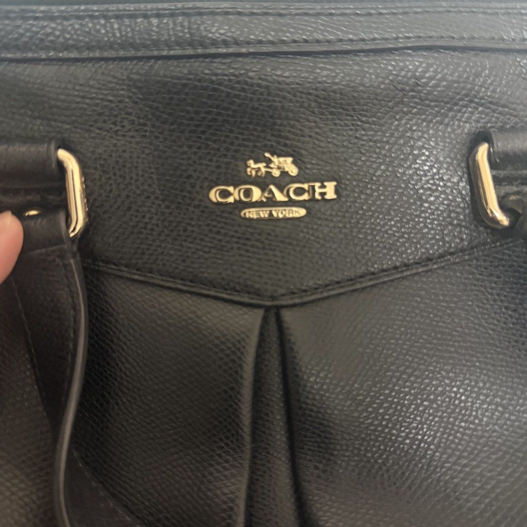 Coach Black Leather Tote Bag (Category: Luxury Bags & Wallets) located in Quezon City. Submitted by zoe_zee (Listing ID 1441306340, Image 1). Description: - Authentic Coach black leather tote bag - Secure zippered top closure - Multiple interior compartments for organization - Elegant gold hardware details - Shows some wear on strap attachment point - Perfect for everyday use.