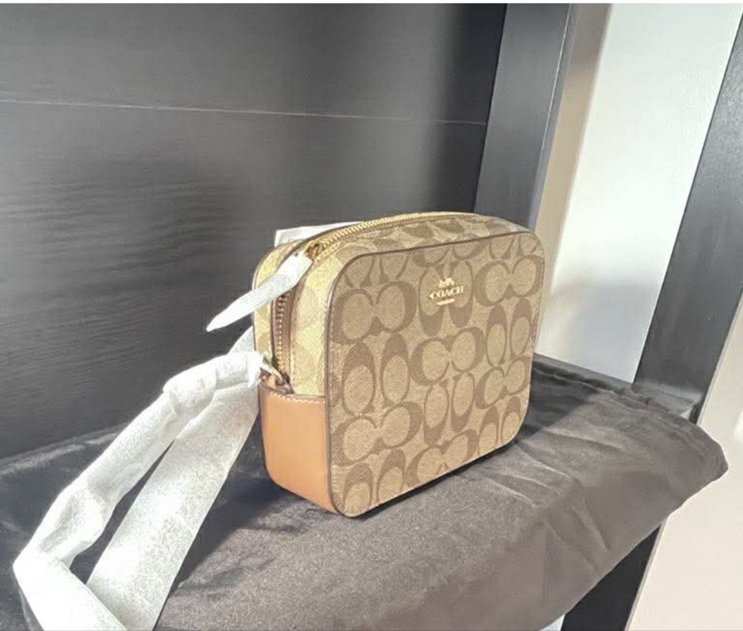 Original Coach Camera Bag (Category: Cross-body Bags) located in Mandaluyong City. Submitted by mintsweet55 (Listing ID 1441186156, Image 2). Description: Original Coach Small Camera Bag 👜✨ Brand new and never used. Compact yet spacious enough to fit your daily essentials such as a phone, wallet, keys, cards, cash, and small personal items. Features a secure zip-top closure and an adjustable strap for comfortable shoulder or crossbody wear. Ligh