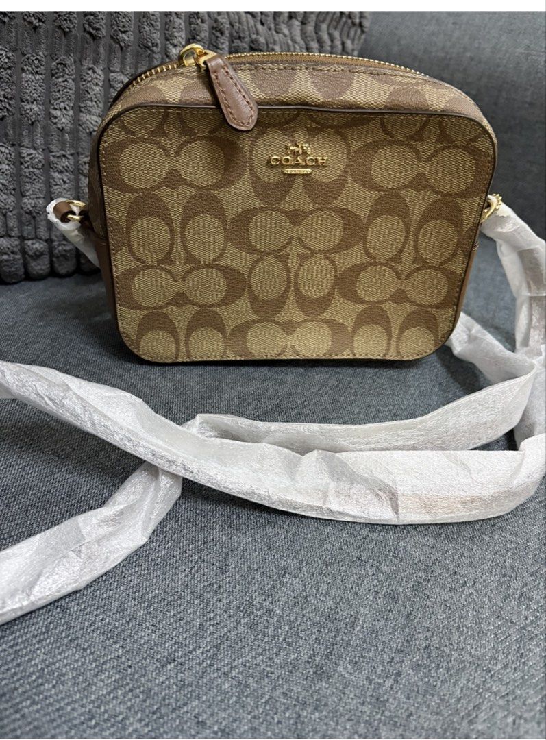Original Coach Camera Bag (Category: Cross-body Bags) located in Mandaluyong City. Submitted by mintsweet55 (Listing ID 1441186156, Image 1). Description: Original Coach Small Camera Bag 👜✨ Brand new and never used. Compact yet spacious enough to fit your daily essentials such as a phone, wallet, keys, cards, cash, and small personal items. Features a secure zip-top closure and an adjustable strap for comfortable shoulder or crossbody wear. Ligh