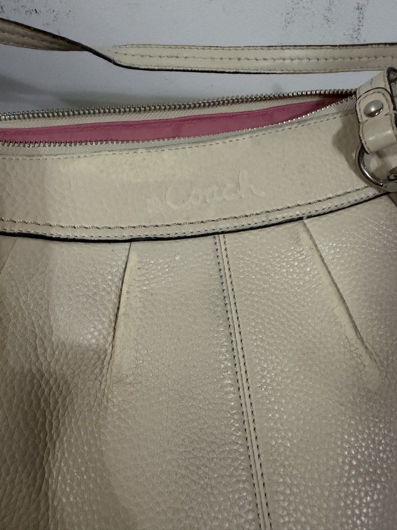Coach Leather Shoulder Bag Cream Pink Interior (Category: Luxury Bags & Wallets) located in Danao, Cebu. Submitted by anne_2016143 (Listing ID 1441267343, Image 2). Description: - Authentic Coach cream leather shoulder bag - Features a stylish pink interior lining - Leather shows some signs of wear, as pictured - Adjustable strap for comfortable wear - A timeless and versatile everyday bag.
