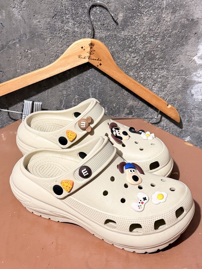 Cream Clogs with Charms Size 40-41 (Category: Sandals) located in Manila. Submitted by rmdthreads (Listing ID 1441176916, Image 1). Description: Rfs: Nakatabi lang, Once lang nagamit. Premium Quality! Size 40-41 (255mm) Bulacan area.