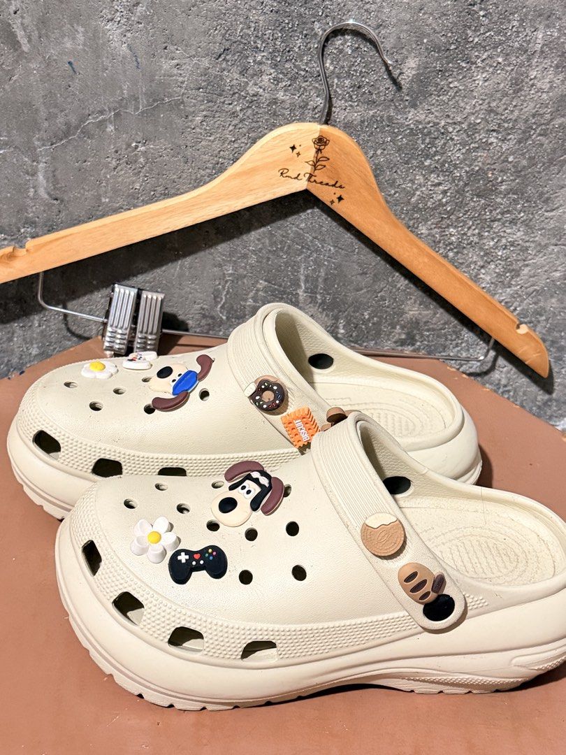 Cream Clogs with Charms Size 40-41 (Category: Sandals) located in Manila. Submitted by rmdthreads (Listing ID 1441176916, Image 2). Description: Rfs: Nakatabi lang, Once lang nagamit. Premium Quality! Size 40-41 (255mm) Bulacan area.
