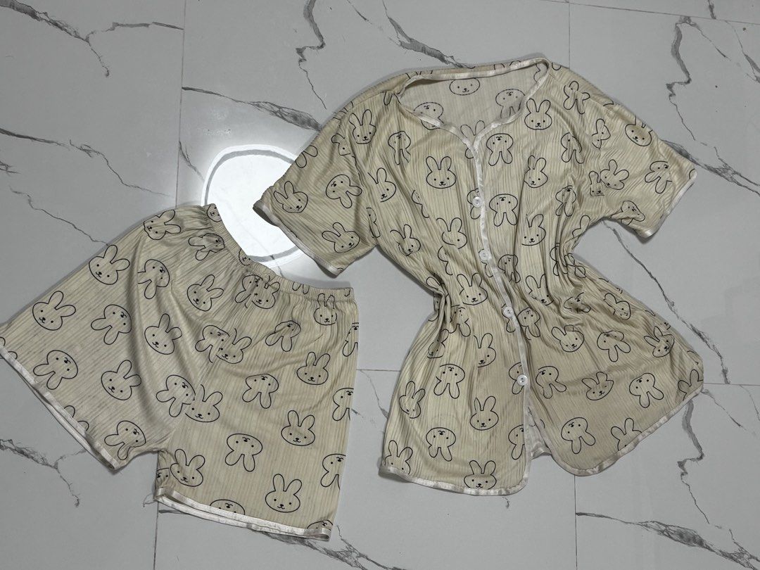 Cute Bunny Pajama Set - Button Up Top & Shorts (Category: Undergarments & Loungewear) located in Penaranda. Submitted by deardarlaph_ (Listing ID 1441338857, Image 2). Description: - Adorable bunny print pajama set - Includes button-up short-sleeve top and matching shorts - Comfortable ribbed fabric texture - Ideal for lounging and sleeping - Perfect for lovers of cute and playful sleepwear.