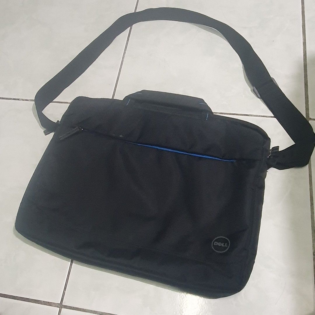 Dell Black Laptop Bag with Shoulder Strap (Category: Laptop Bags & Sleeves) located in Pasig City. Submitted by phgigapro (Listing ID 1441217136, Image 1). Description: - Black Dell laptop bag - Features a handle and a detachable shoulder strap - Interior pockets for easy organization - Ideal for carrying your laptop and essentials - Zippers are in good working condition - Ready for its new owner.