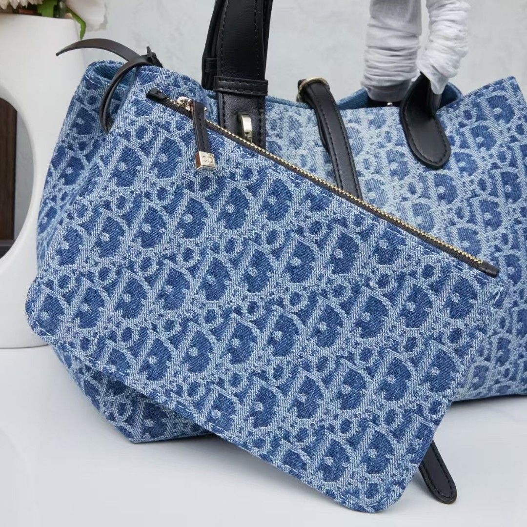 Dior Denim Monogram Tote Bag with Pouch (Category: Luxury Bags & Wallets) located in Manila. Submitted by brekkas.ph (Listing ID 1441228931, Image 2). Description: - Authentic Dior tote bag - Classic blue denim with signature monogram print - Includes a matching zippered pouch - Durable black leather handles and trim - Elegant gold-tone 'Dior' charms - Ideal for everyday style and practicality P12800.