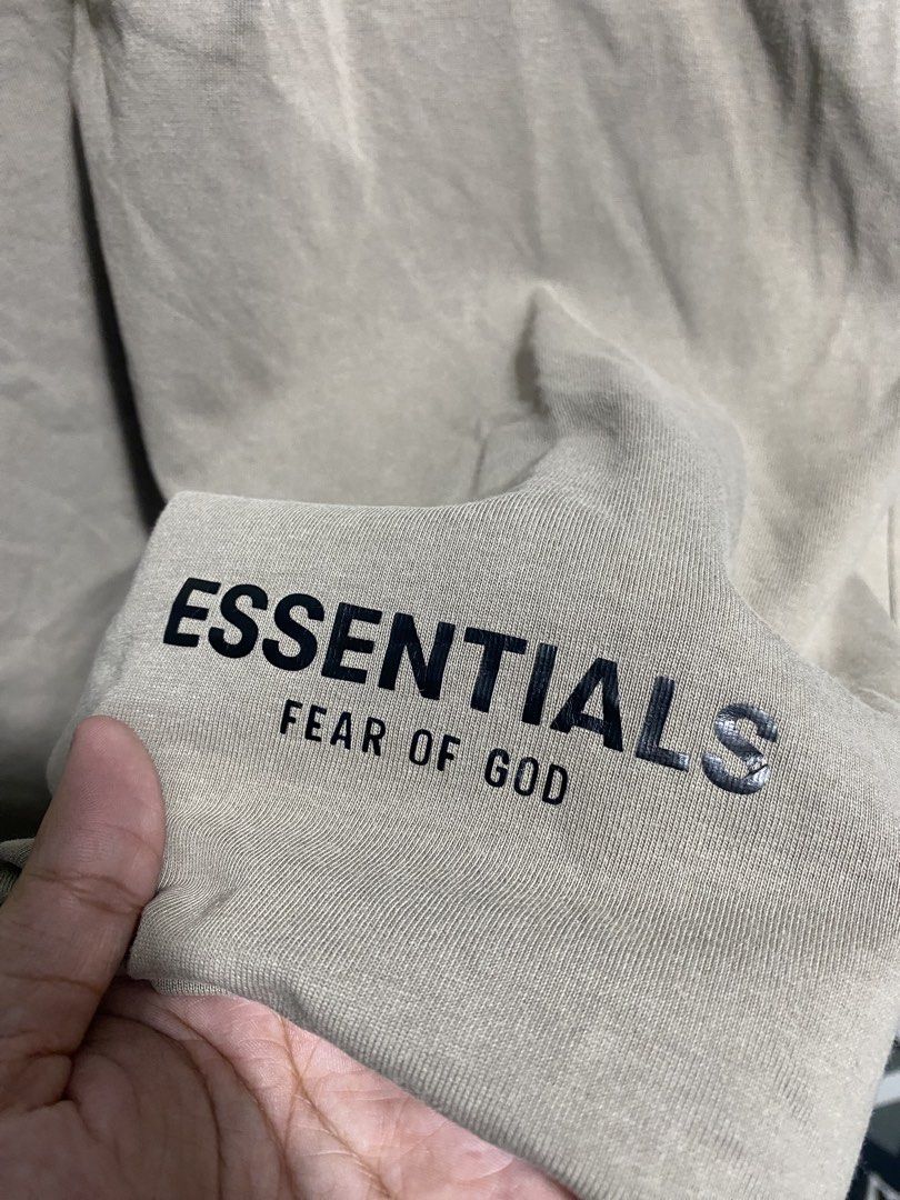 Fear of God Essentials Los Angeles T-Shirt (Category: Tshirts & Polo Shirts ) located in Naga. Submitted by thesource4400 (Listing ID 1441318350, Image 3). Description: - Brand: Fear of God Essentials - Color: Brown - Front Graphic: 'ESSENTIALS FEAR OF GOD' - Back Graphic: 'ESSENTIALS LOS ANGELES' - Style: Casual, comfortable, and stylish.