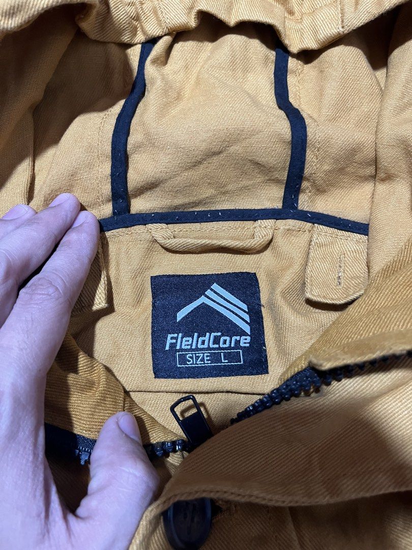 FieldCore Mustard Yellow Hooded Jacket Size L (Category: Coats, Jackets and Outerwear) located in Manila. Submitted by mjaothrift (Listing ID 1441326928, Image 3). Description: - FieldCore hooded jacket - Color: Mustard Yellow - Size: L - Closure: Zip and button - Features: Multiple front pockets, adjustable drawstring hood - Ideal for: Outdoor activities and casual wear.