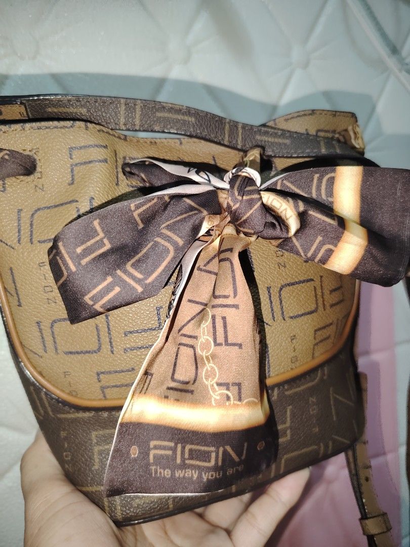 Fion mini bucket bag (Category: Luxury Bags & Wallets) located in Bulacan. Submitted by jhefkheelo02163 (Listing ID 1441159743, Image 2). Description: Fion mini bucket bag Kasya cp and med size wallet Likenew Super nice in actual .