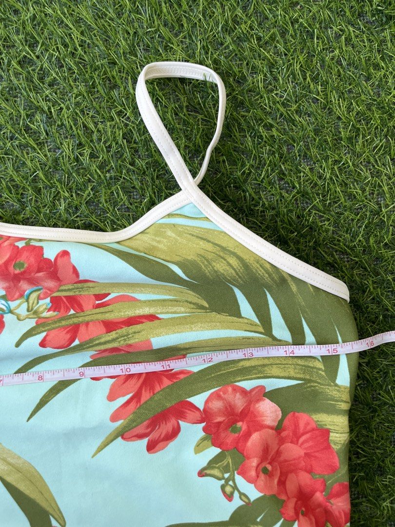Floral Print Bikini Set with Tie Sides (Category: Bikinis & Swimsuits) located in Bacolod City. Submitted by marbiii (Listing ID 1441246912, Image 2). Description: - Light blue bikini with a vibrant floral print (red & blue flowers, green leaves) - Bikini bottoms with adjustable tie sides - Top features thin spaghetti straps - Ideal for beach or pool outings **NO PADS!! BEST FITS LARGE!!.