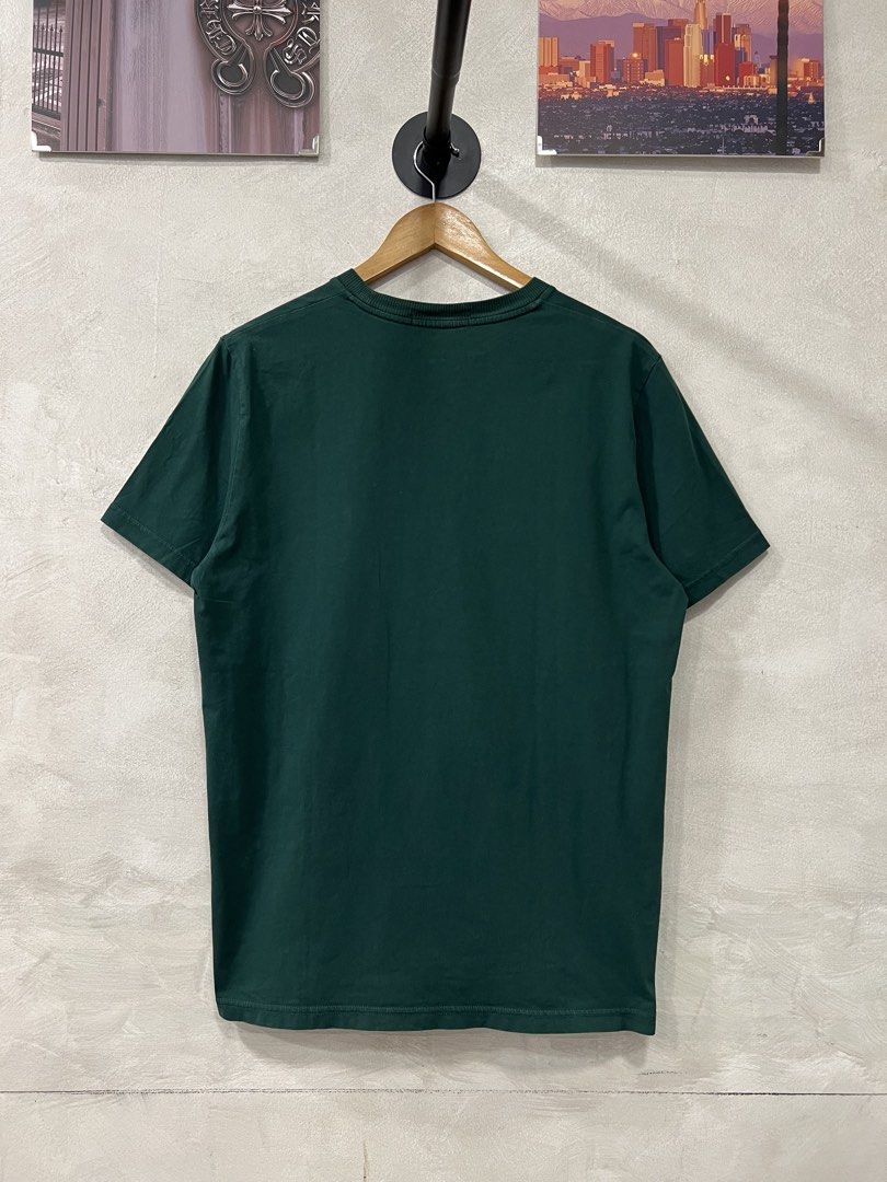 Fred Perry Men's printed T-Shirt (Category: Tshirts & Polo Shirts ) located in Manila. Submitted by -handpick- (Listing ID 1441278365, Image 3). Description: - Green Fred Perry T-shirt - Size: Medium (M) - Chest graphic block with stripe detail - Embroidered Fred Perry laurel wreath logo on graphic - Classic crew neck and short sleeves - Plain green back Dimensions : Length : 27 Width : 20.5 Issue : None .