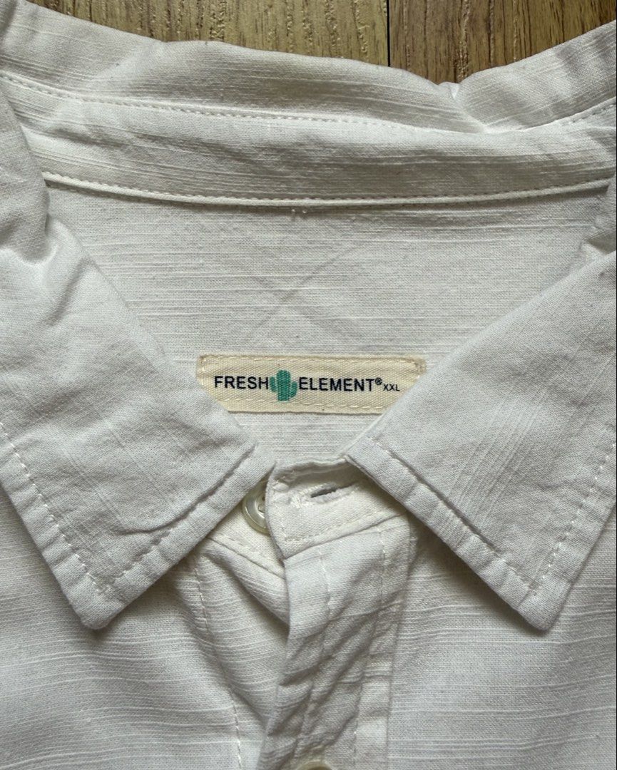 Fresh Element Short Sleeve Button-down Polo Shirt (Category: Tshirts & Polo Shirts ) located in Taytay. Submitted by nextsentials (Listing ID 1441213481, Image 3). Description: - Authentic Fresh Element short sleeve button-down polo shirt - Pure white color - Comfortable, regular fit - Good for casual, everyday use Measurements: Body length - 72cm Chest width - 52cm Shoulder width - 46cm Sleeve length - 23cm.