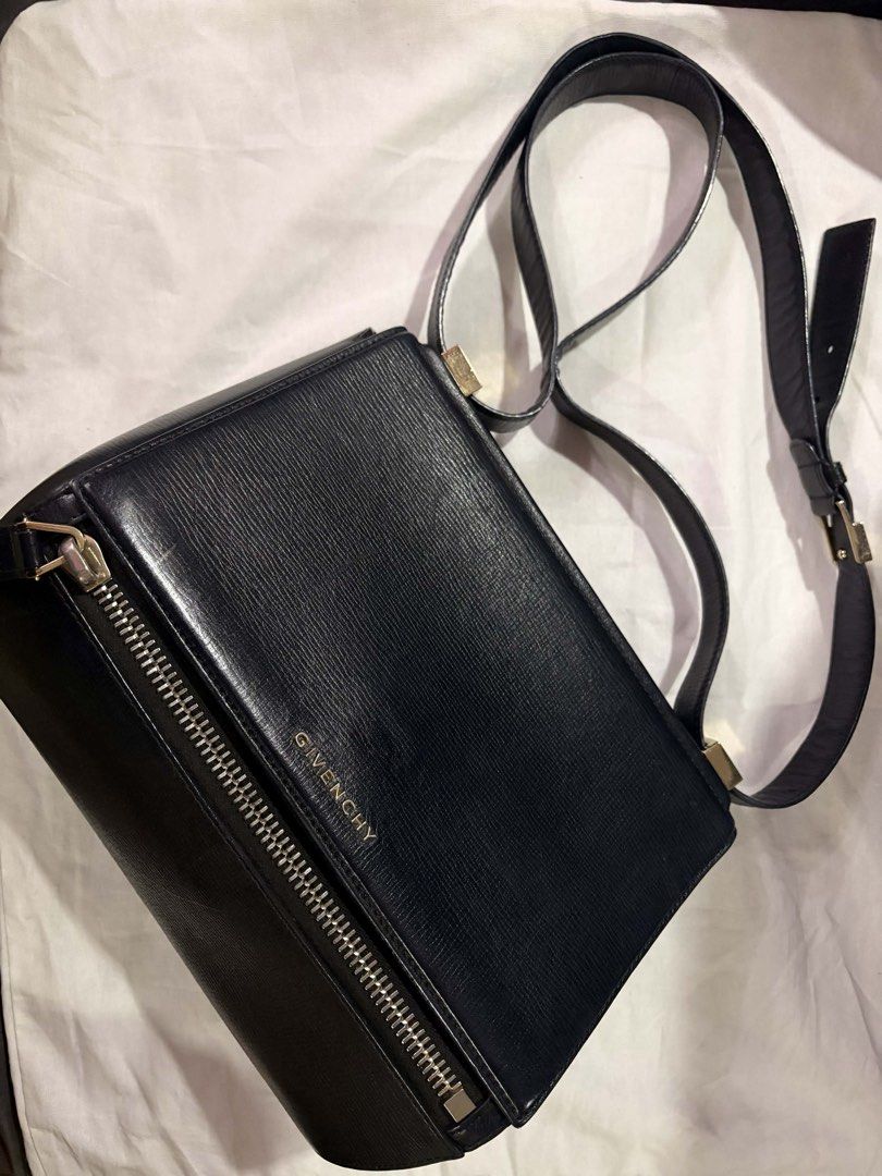 Givenchy Pandora Medium Shoulder Bag (Category: Luxury Bags & Wallets) located in Mandaluyong City. Submitted by seanytest (Listing ID 1441365129, Image 1). Description: - Authentic Givenchy black leather shoulder bag - Textured leather finish for a sophisticated look - Secure front zipper closure - Adjustable strap for comfortable wear - Elegant gold hardware details - Classic and versatile design, suitable for everyday or evening use Givenchy P