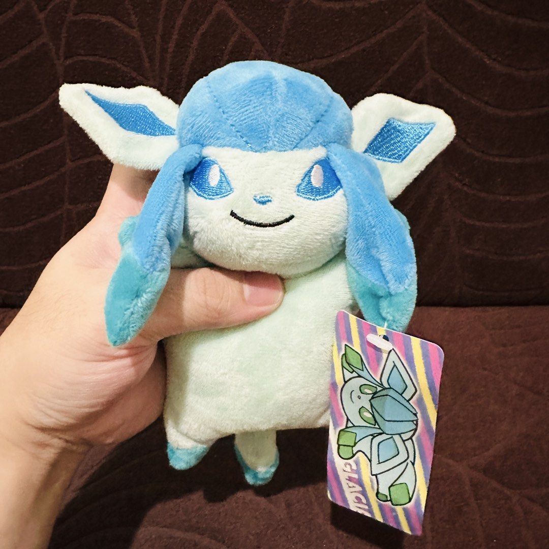 Glaceon Pokemo Plush charm (Category: Toys & Games) located in Mandaluyong City. Submitted by johnmichaelb.reyes (Listing ID 1441373418, Image 1). Description: - Adorable Glaceon plush toy from the official Pokemon Center. - Approximately 6 inches tall, perfect for display or play. - Features a convenient keychain clip, ideal for attaching to bags, backpacks, or keys. - A must-have for any Pokemon enthusiast or collector. - Released in 2017..