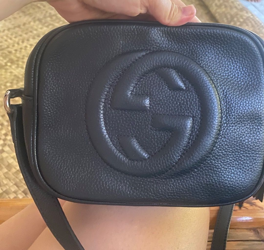 Gucci Soho Disco Bag Black Leather (Category: Luxury Bags & Wallets) located in Samal. Submitted by newturtle.528f0d (Listing ID 1441215312, Image 1). Description: - Authentic Black Leather Gucci Soho Disco Bag - Features embossed GG logo on the front - Small tassel detail on the zipper - Adjustable shoulder strap for comfortable wear - Versatile for everyday use or evening events - Comes with original dust bag.