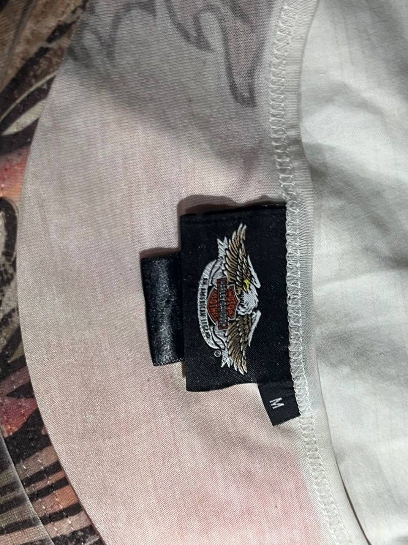 Harley-Davidson Graphic T-Shirt (Category: Tshirts & Polo Shirts ) located in Manila. Submitted by ines_montgomery (Listing ID 1441251157, Image 3). Description: - Cool graphic tee - Features a dragon and Harley-Davidson logo - Short sleeves, scoop neck - Faded, vintage print - Size M - Perfect for Harley fans.