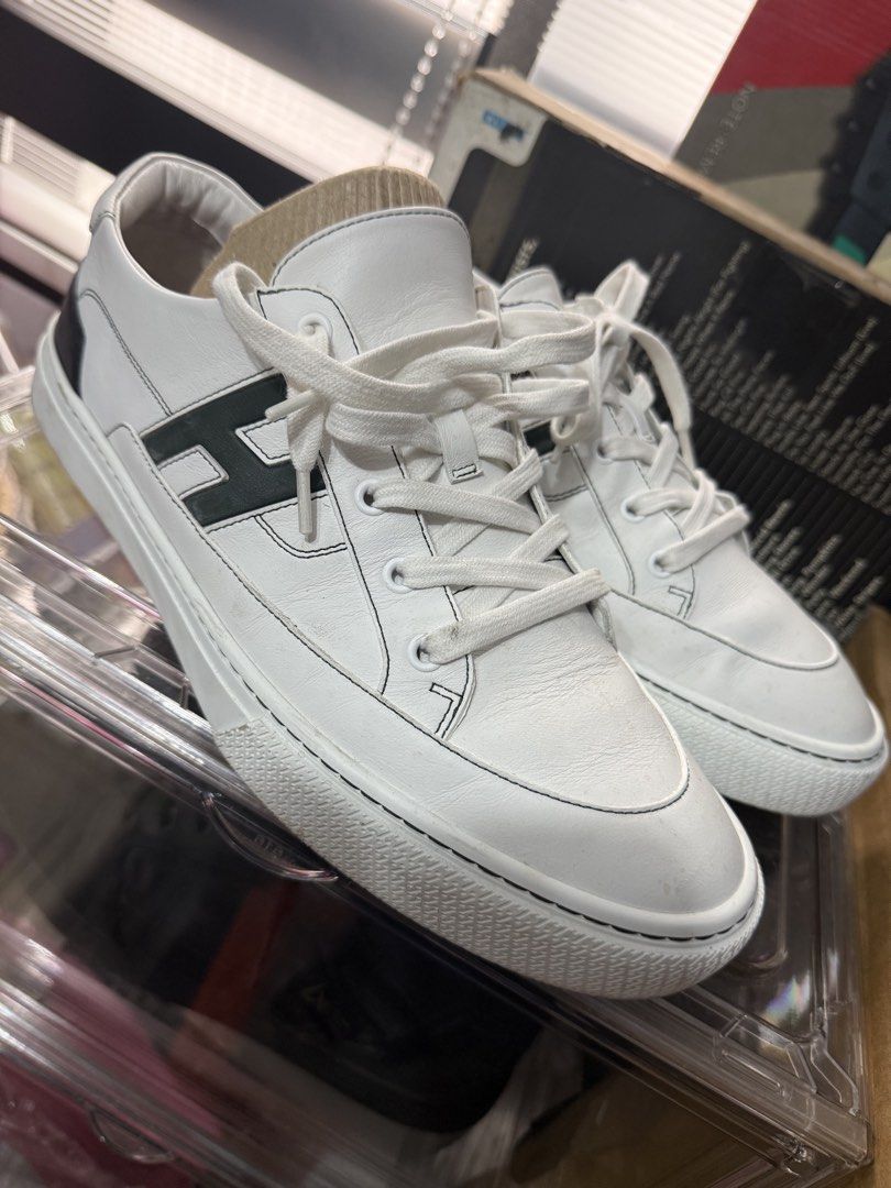 Hermes Deep Sneaker White with Green H Logo (Category: Sneakers) located in Manila. Submitted by kjhelera (Listing ID 1441318790, Image 2). Description: - Authentic Hermes white leather sneakers - Features iconic green H logo on the side - Perfect for everyday wear -Size 44 /US 11 -Used once -No box.
