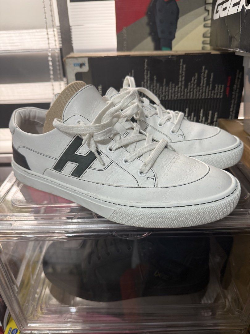Hermes Deep Sneaker White with Green H Logo (Category: Sneakers) located in Manila. Submitted by kjhelera (Listing ID 1441318790, Image 3). Description: - Authentic Hermes white leather sneakers - Features iconic green H logo on the side - Perfect for everyday wear -Size 44 /US 11 -Used once -No box.
