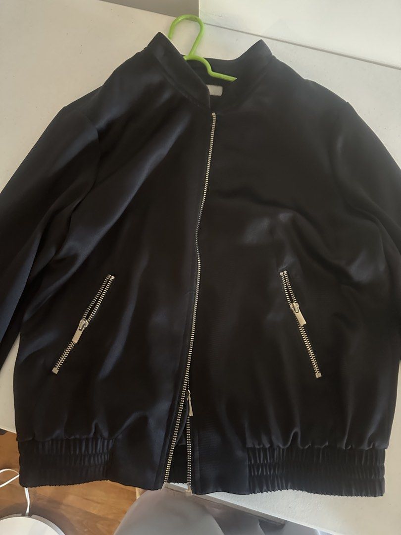H&M Black Bomber Jacket (Category: Coats, Jackets and Outerwear) located in Makati City. Submitted by agm_2026 (Listing ID 1441157714, Image 1). Description: - H&M Black Bomber Jacket - Zip-up front closure - Side zippered pockets - Ribbed cuffs and hem for a snug fit - Versatile for layering or standalone wear - Easily pairs with jeans or trousers.