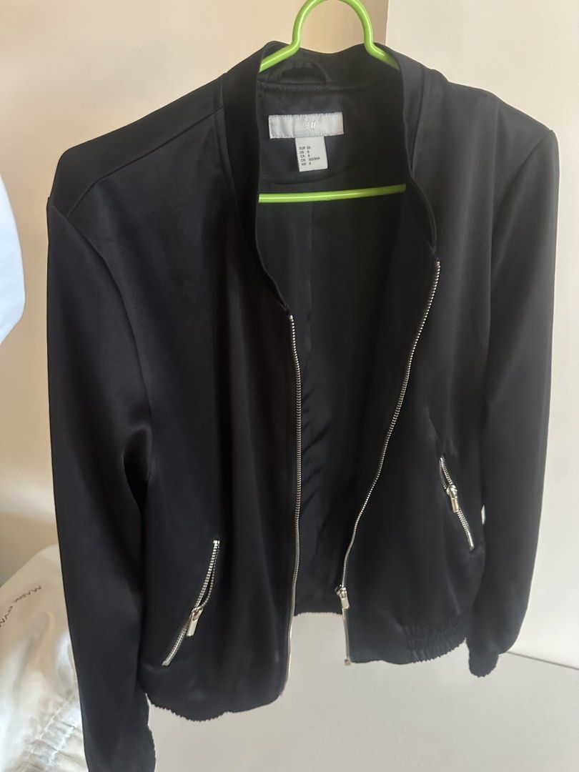 H&M Black Bomber Jacket (Category: Coats, Jackets and Outerwear) located in Makati City. Submitted by agm_2026 (Listing ID 1441157714, Image 2). Description: - H&M Black Bomber Jacket - Zip-up front closure - Side zippered pockets - Ribbed cuffs and hem for a snug fit - Versatile for layering or standalone wear - Easily pairs with jeans or trousers.
