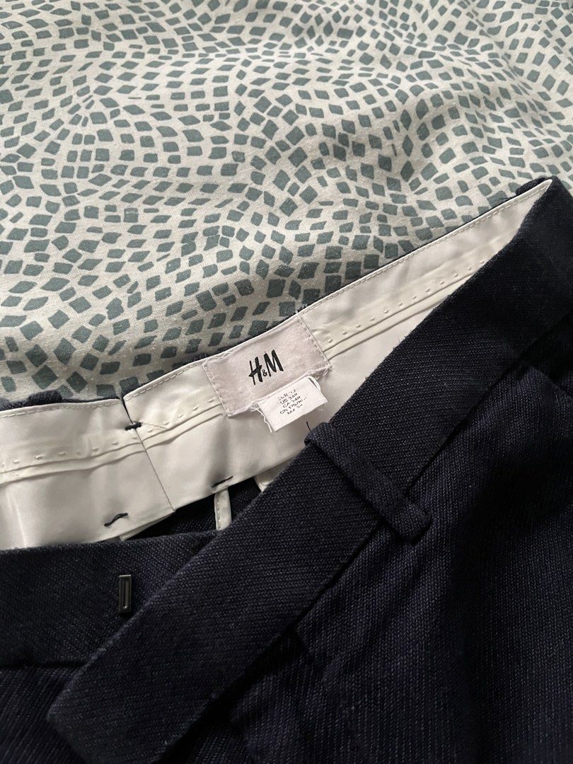H&M Dark Blue Textured Trousers (Category: Trousers) located in Quezon City. Submitted by heiressofpersia80 (Listing ID 1441183490, Image 3). Description: - Brand: H&M - Color: Dark Blue - Fit: Classic - Fabric: Textured linen - Features: Belt loops, button and zip closure - Style: Versatile for smart casual or work wear - Comfort: Made with comfortable material.