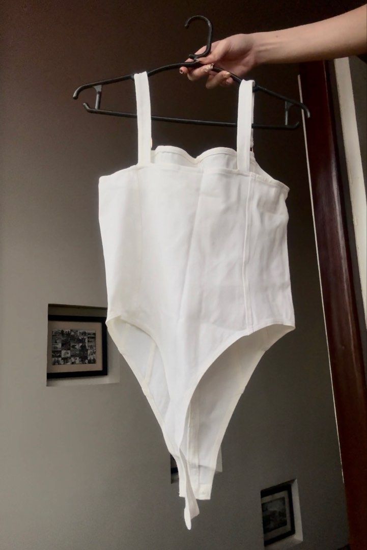 H&M White Corset Style Bodysuit (Category: Others Tops) located in Santa Rosa. Submitted by prelovedby.her_ (Listing ID 1441329389, Image 2). Description: Color: White Size: S Condition: No visible flaws; in great condition RFS: Decluttering 🧹 📍 Shipping from: Fairview, QC 🚚 Mode of Delivery: Lalamove | J&T 💵 Payment: GCash | Bank Transfer Feel free to message for any questions! 🤍.