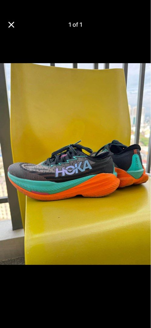 Hoka Mach 2 Running Shoes (Category: Sneakers) located in Manila. Submitted by gotlistedph (Listing ID 1441356062, Image 1). Description: - Hoka Mach 2 running shoes - Color: Black with orange and teal accents - Versatile: Great for running or everyday wear - Condition: Laces intact, soles look good - Ready for your next run! Hoka Sizing Womens Japan 24 UK 5.5 Eu 38 2/3 Original price bought: 12k.
