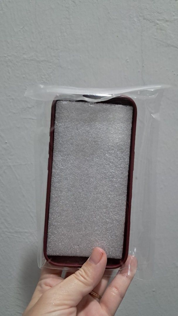 Iphone Cover (Category: Cases & Covers) located in Puchong. Submitted by gr33n_apple (Listing ID 1441336310, Image 2). Description: - Stylish maroon iPhone cover - Faux leather material - Features a convenient card slot on the back .